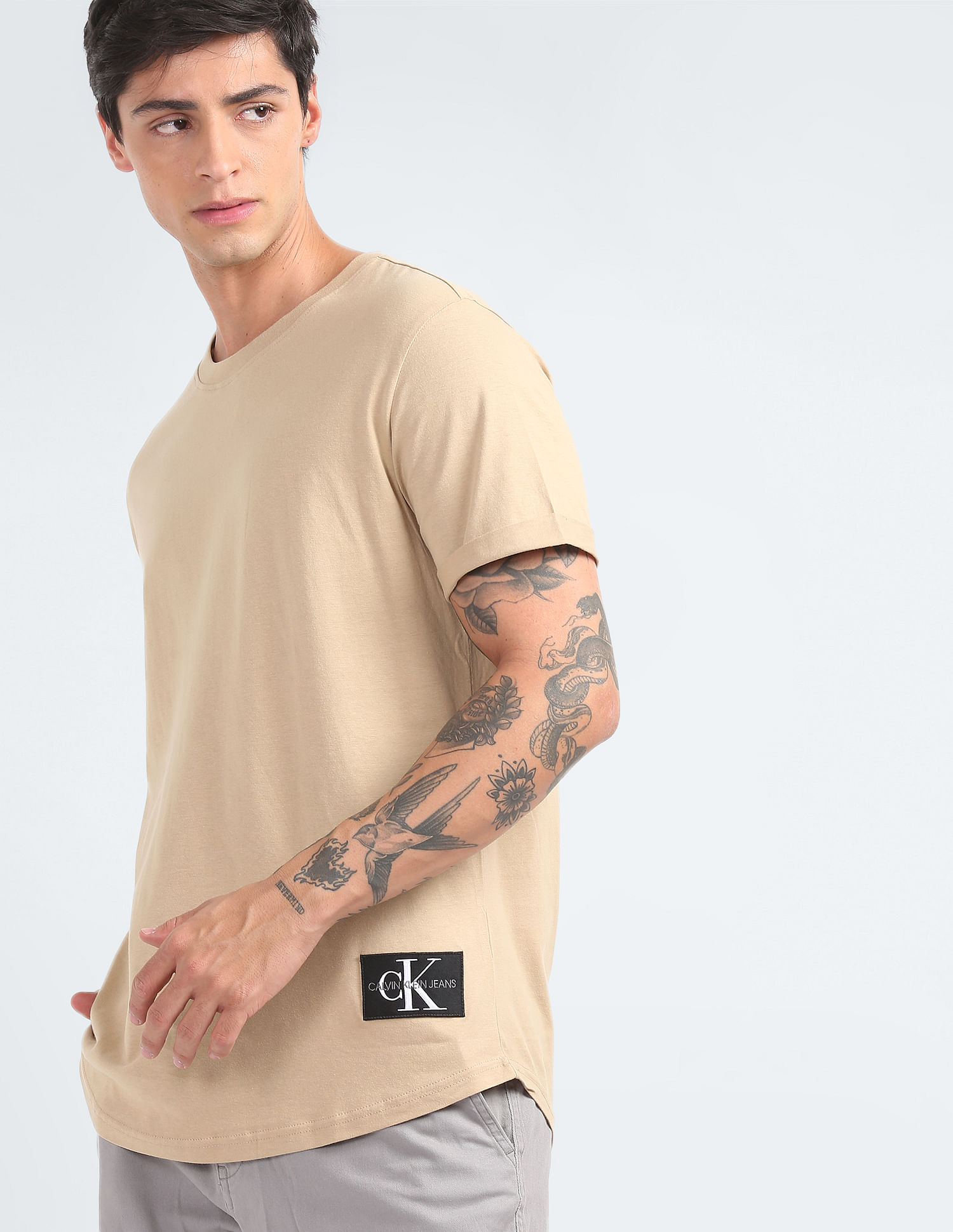 Buy Calvin Klein Jeans Turn Up Sleeve Badge Logo T-Shirt