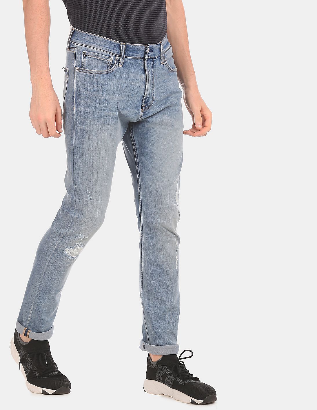 Buy Calvin Klein Men Blue Tapered Fit Distressed Jeans - NNNOW.com